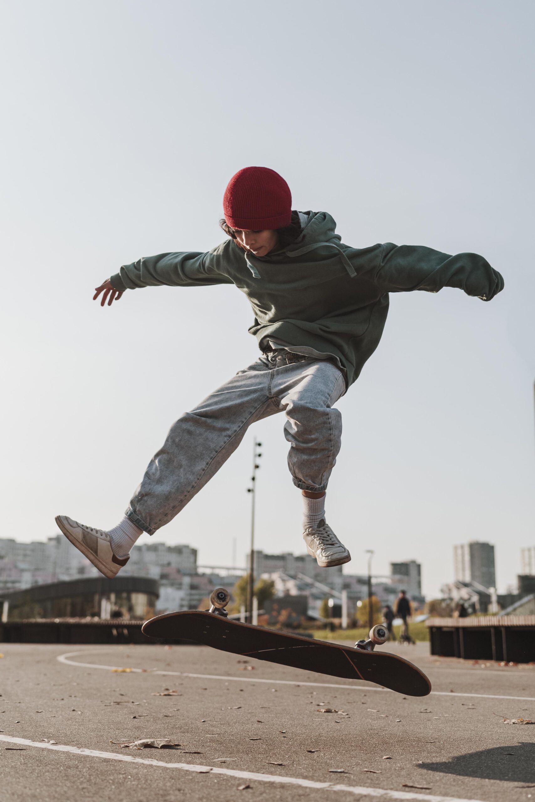 front-view-teenager-with-skateboard-outside